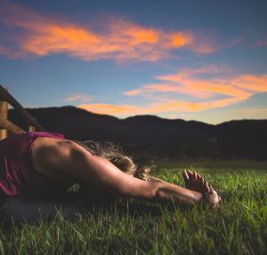 Woman in yoga position early in the morning